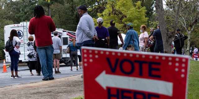 Voters line up for early voting at a Fulton County mobile voting station on Oct. 12, 2020 at St. Paul's Episcopal Church in Southwest Atlanta. (Ben Gray/Atlanta Journal-Constitution via AP)