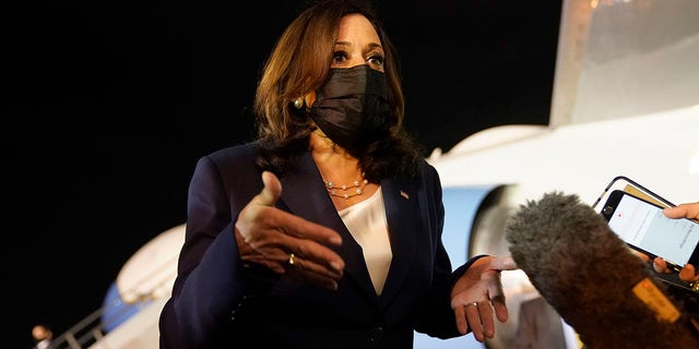 Vice President Kamala Harris talks to the press gathered under the wing of Air Force Two as she prepares to depart for Mexico, from Guatemala's Air Force Central Command, Monday, June 7, 2021. (AP Photo/Jacquelyn Martin)