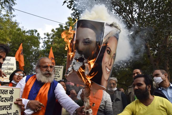 burn portraits of Meena Harris, niece of U.S. Vice President Kamala Harris, and Greta Thunberg in New Delhi, India, Thursday, Feb. 4, 2021. As the farmers camp out at the edges of the capital, protesting new agricultural laws they say will devastate their earnings, the mainstream and social media have come under unprecedented attacks from Prime Minister Narendra Modi’s Bharatiya Janata Party. Critics say it has used the massive demonstrations to escalate a crackdown on free speech, detaining journalists and freezing Twitter accounts. (AP Photo/Dinesh Joshi)